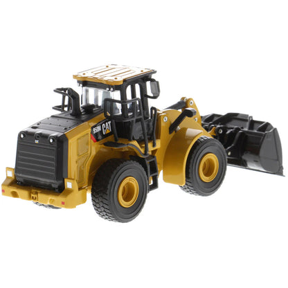 Model of a Caterpillar 950M Wheel Loader with Log Grappler and Longs on a White Background