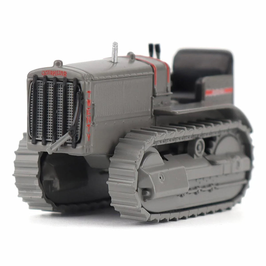 Model of a Caterpillar Twenty Crawler Tractor on a White Background