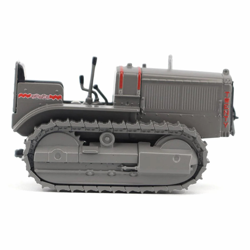 Model of a Caterpillar Twenty Crawler Tractor on a White Background