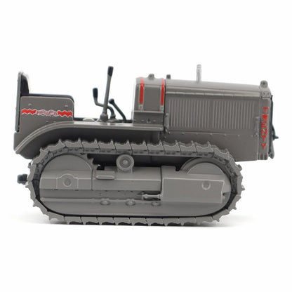 Model of a Caterpillar Twenty Crawler Tractor on a White Background
