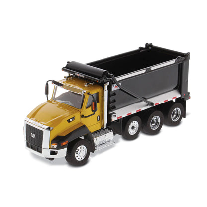 Model of a yellow dump truck with black bed on a white background