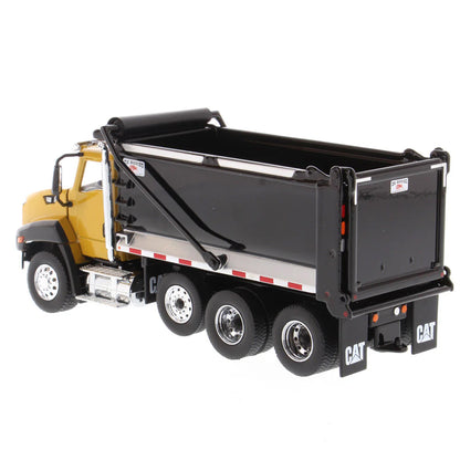Model dump truck with yellow cab and black bed on a white background