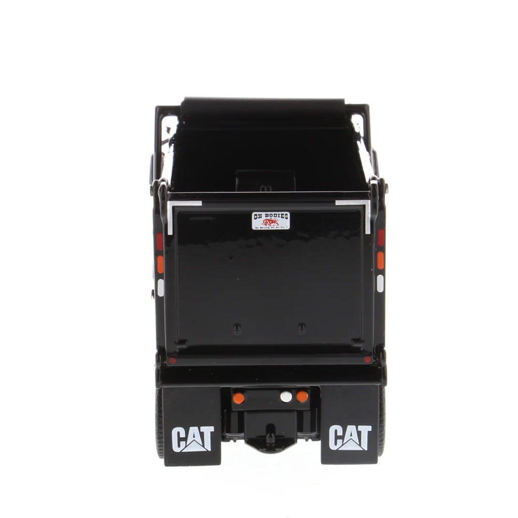 Black Caterpillar dump truck on a white background