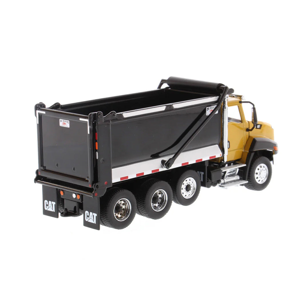 Model dump truck with black bed and yellow body on a white background