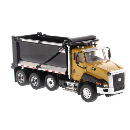 Model of a dump truck with a black bed and gold cab on a white background