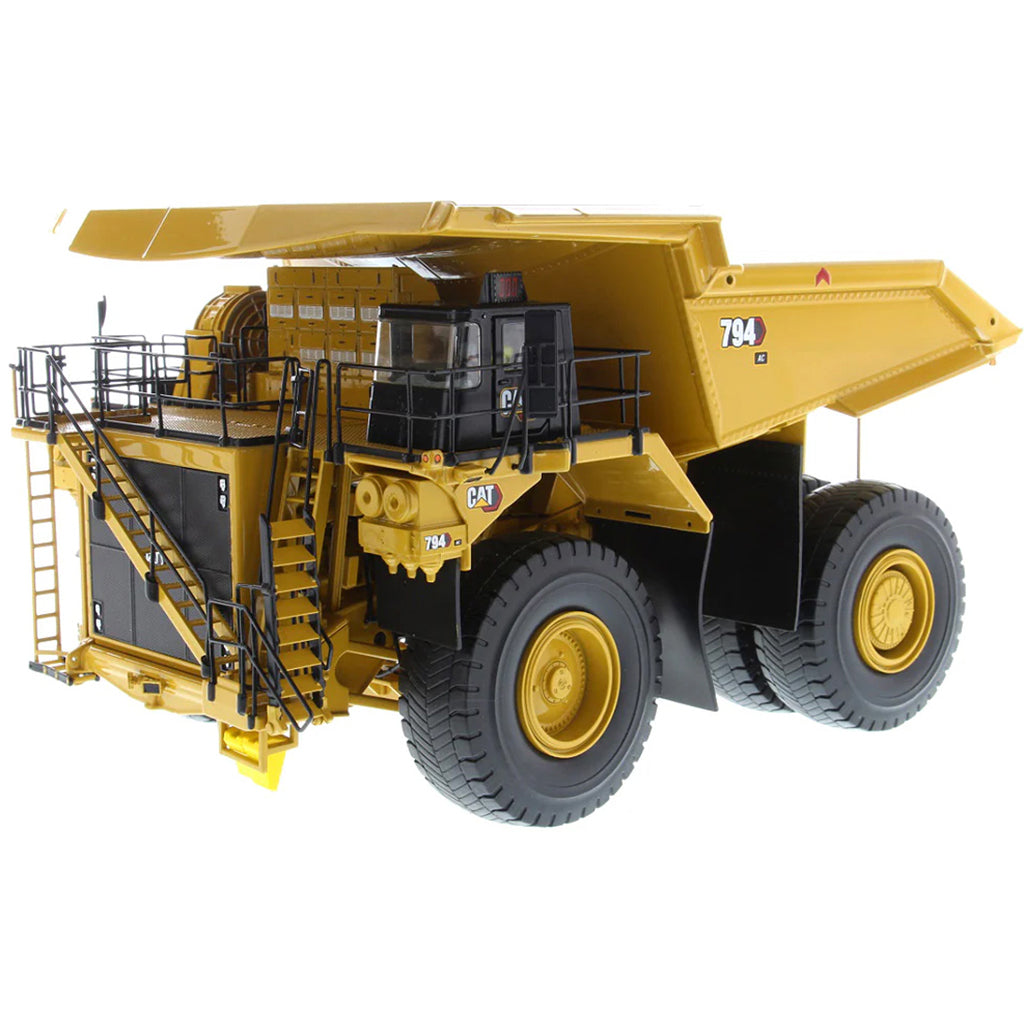 Model of Caterpillar 794 AC Mining Dump Truck on a White Background