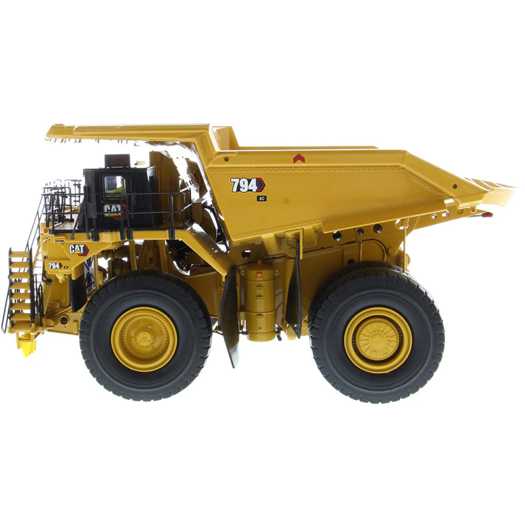 Model of Caterpillar 794 AC Mining Dump Truck on a White Background