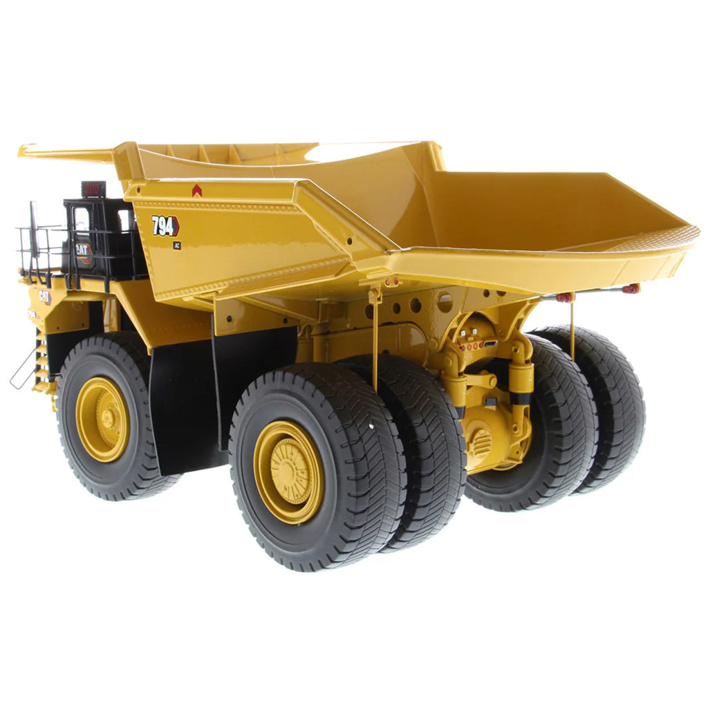 Model of Caterpillar 794 AC Mining Dump Truck on a White Background
