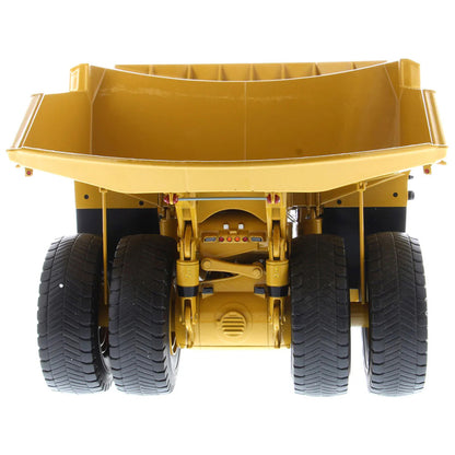 Model of Caterpillar 794 AC Mining Dump Truck on a White Background