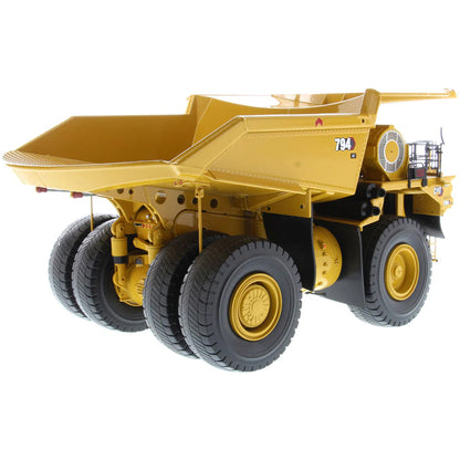 Model of Caterpillar 794 AC Mining Dump Truck on a White Background
