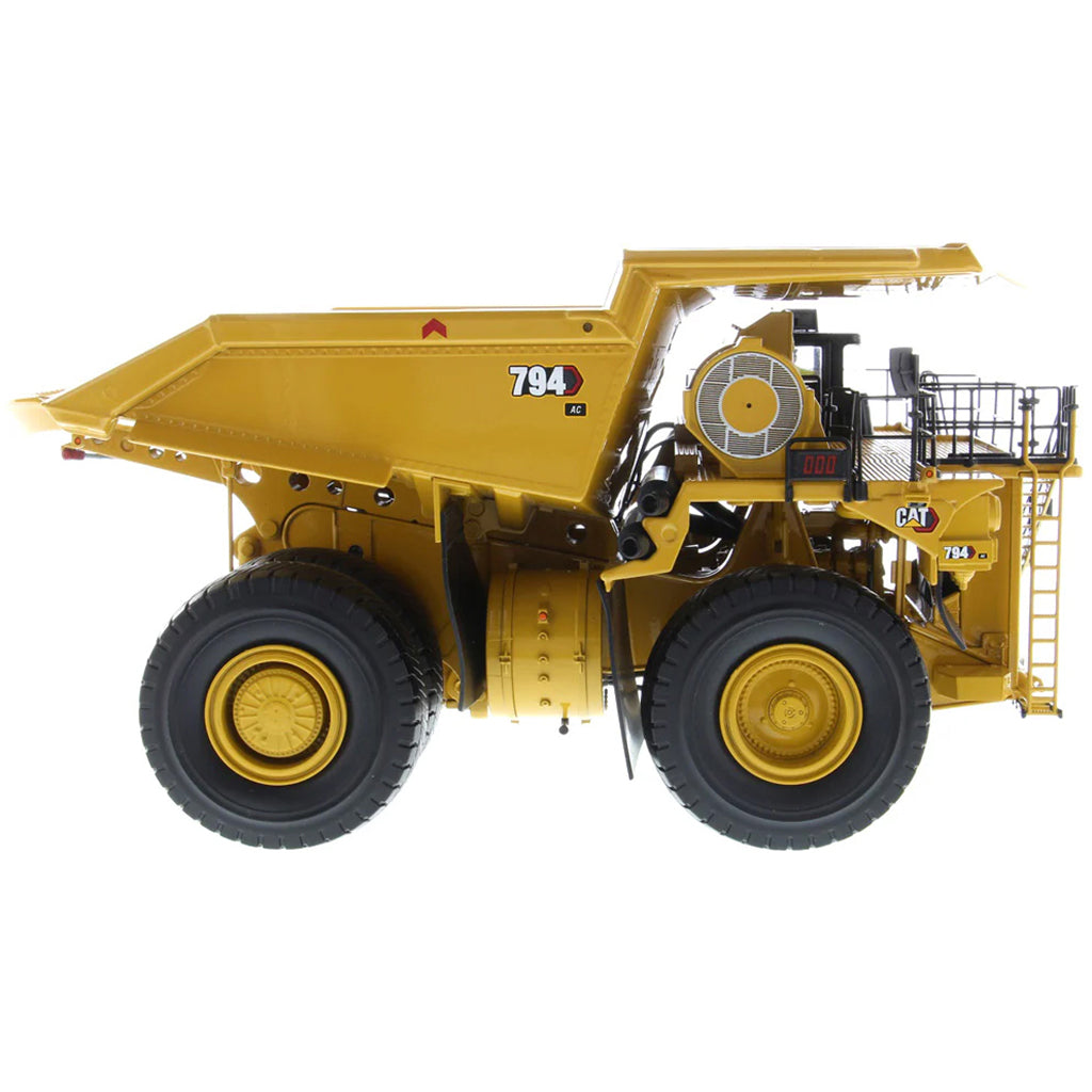 Model of Caterpillar 794 AC Mining Dump Truck on a White Background