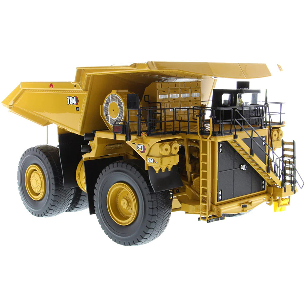 Model of Caterpillar 794 AC Mining Dump Truck on a White Background
