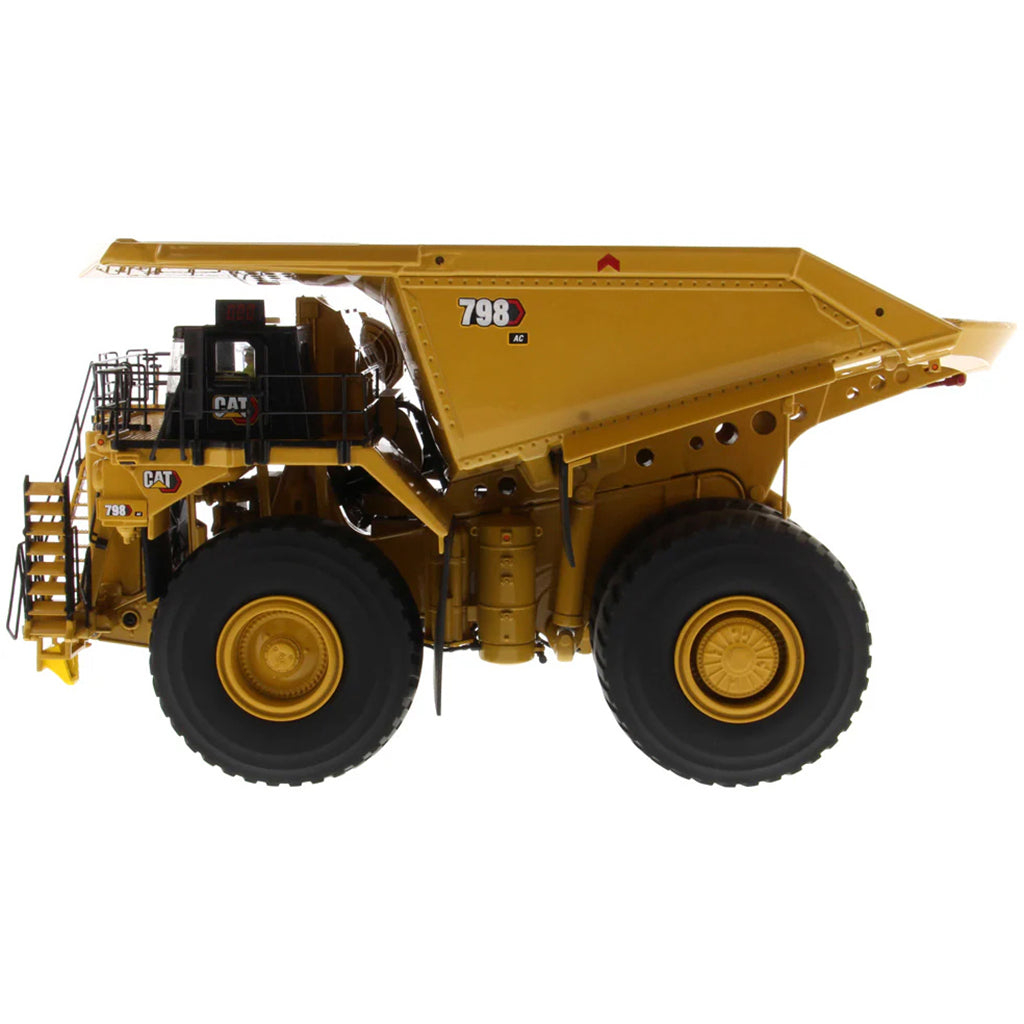 Model of a Large Caterpillar 798 AC Off Highway Electric Drive Mining Dump Truck on a White Background