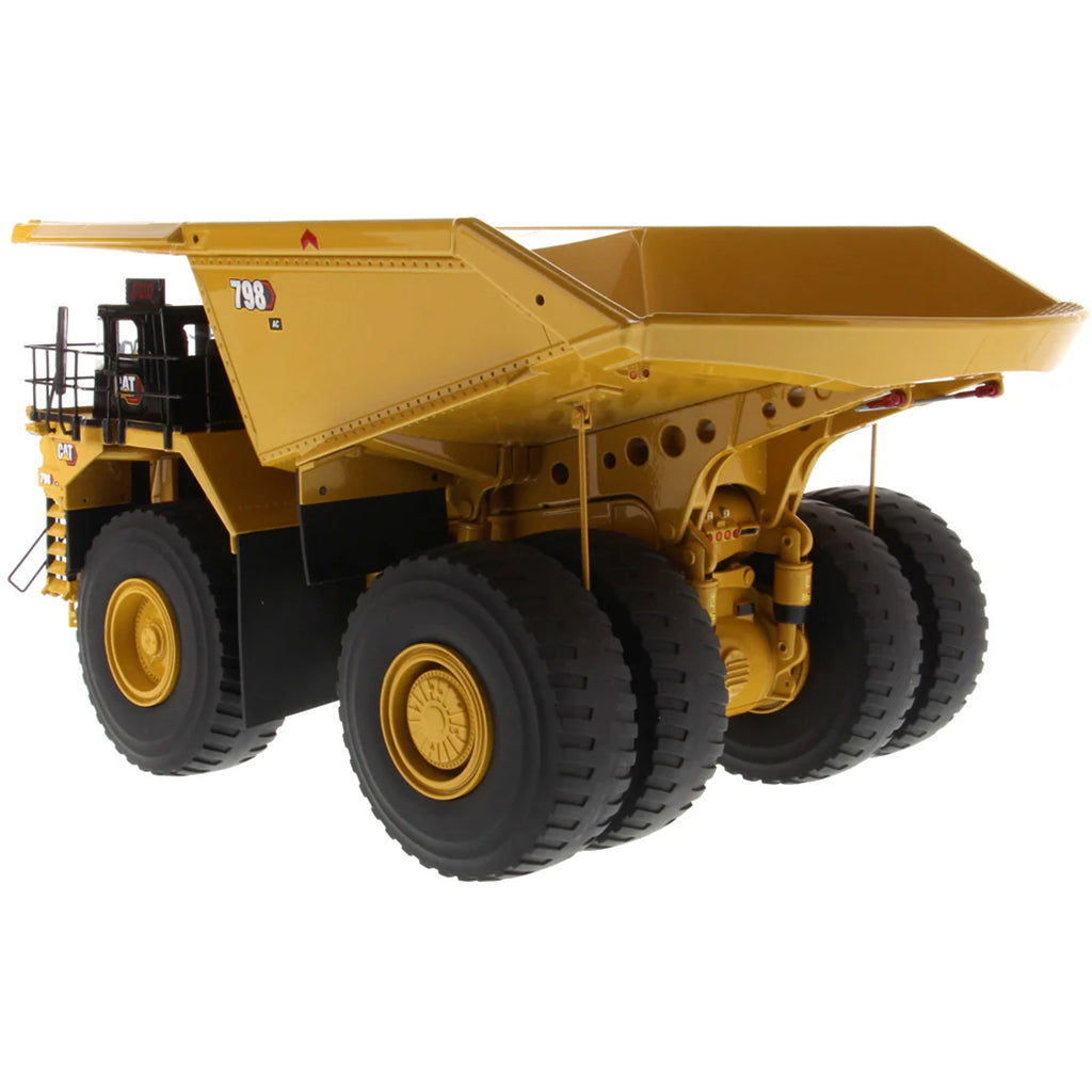 Model of a Large Caterpillar 798 AC Off Highway Electric Drive Mining Dump Truck on a White Background