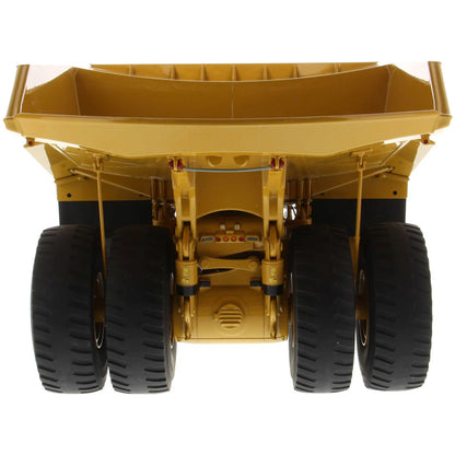 Model of a Large Caterpillar 798 AC Off Highway Electric Drive Mining Dump Truck on a White Background
