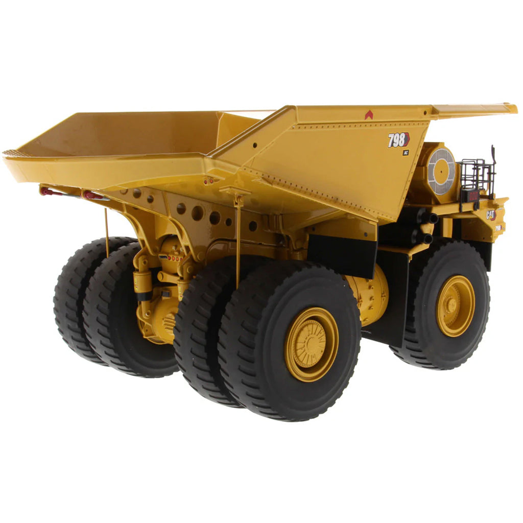 Model of a Large Caterpillar 798 AC Off Highway Electric Drive Mining Dump Truck on a White Background