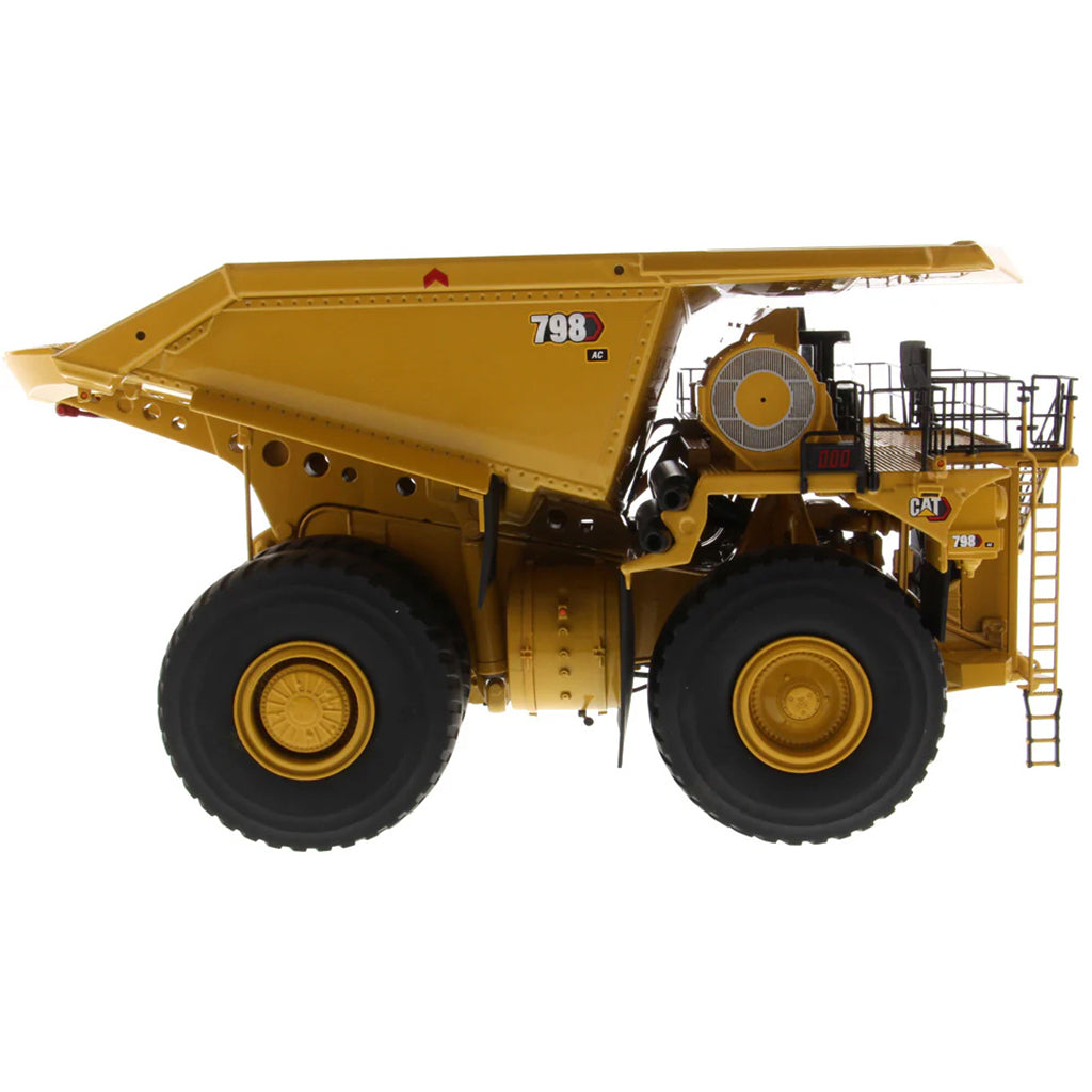 Model of a Large Caterpillar 798 AC Off Highway Electric Drive Mining Dump Truck on a White Background