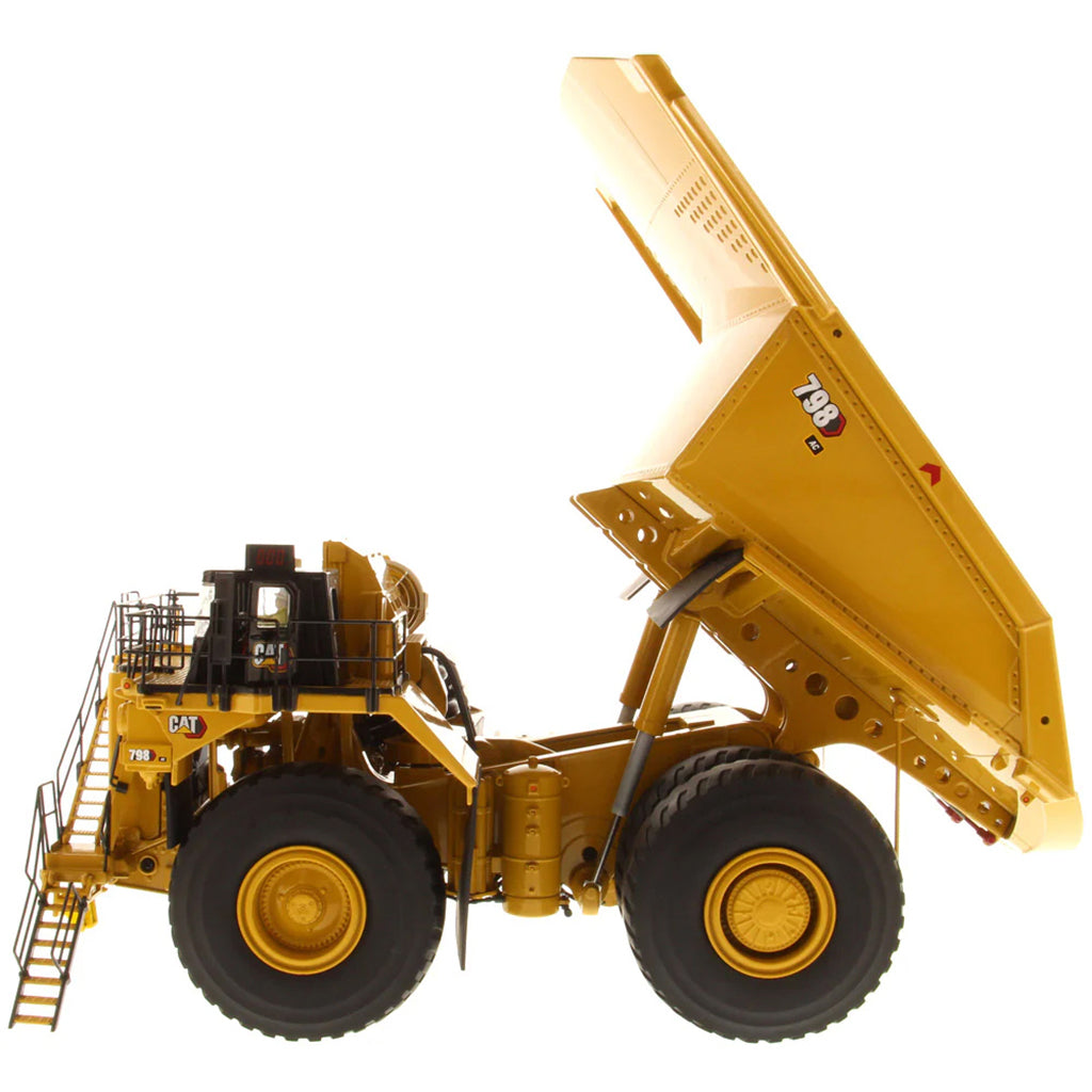 Model of a Large Caterpillar 798 AC Off Highway Electric Drive Mining Dump Truck on a White Background