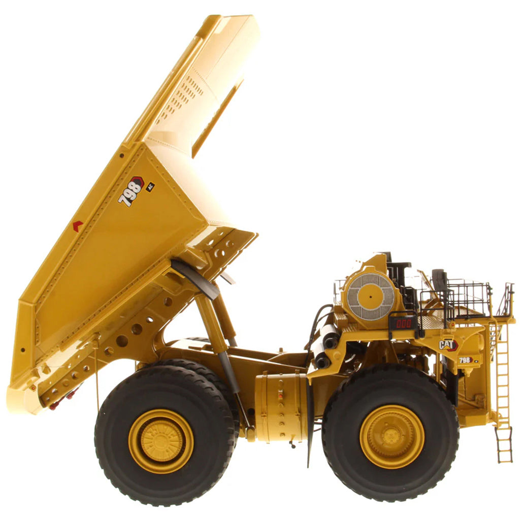 Model of a Large Caterpillar 798 AC Off Highway Electric Drive Mining Dump Truck on a White Background