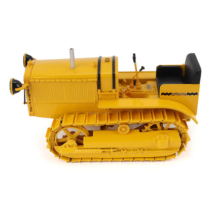 Model of a CAT Machine Yellow Caterpillar Twenty-Five Crawler Tractor with Headlights on a White Background