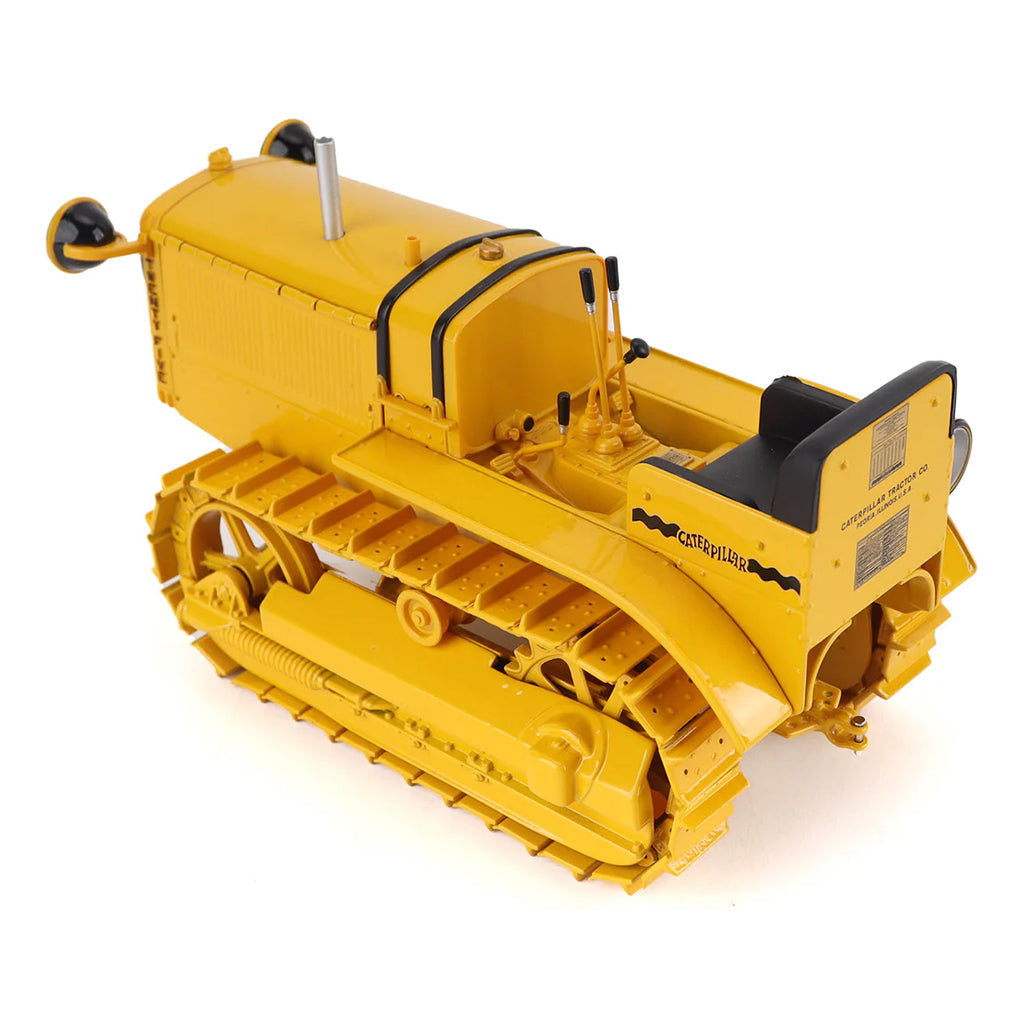 Model of a CAT Machine Yellow Caterpillar Twenty-Five Crawler Tractor with Headlights on a White Background
