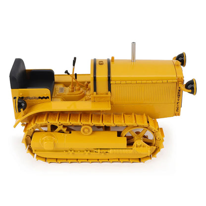 Model of a CAT Machine Yellow Caterpillar Twenty-Five Crawler Tractor with Headlights on a White Background