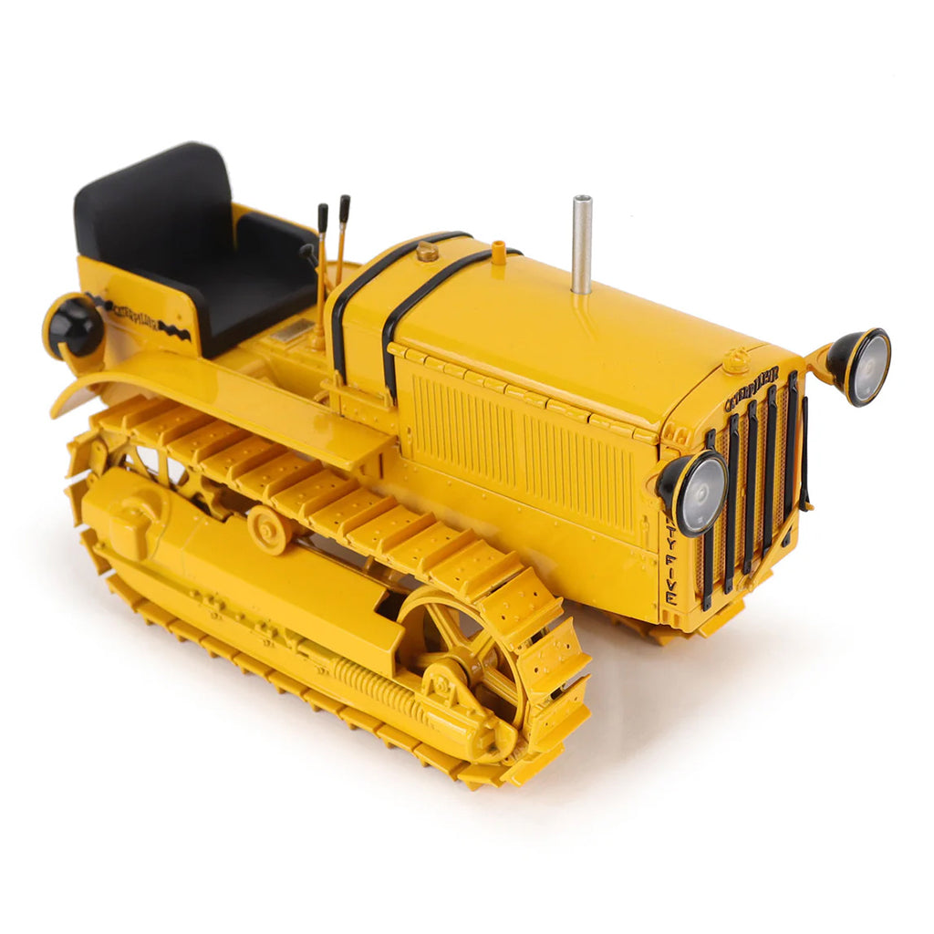 Model of a CAT Machine Yellow Caterpillar Twenty-Five Crawler Tractor with Headlights on a White Background