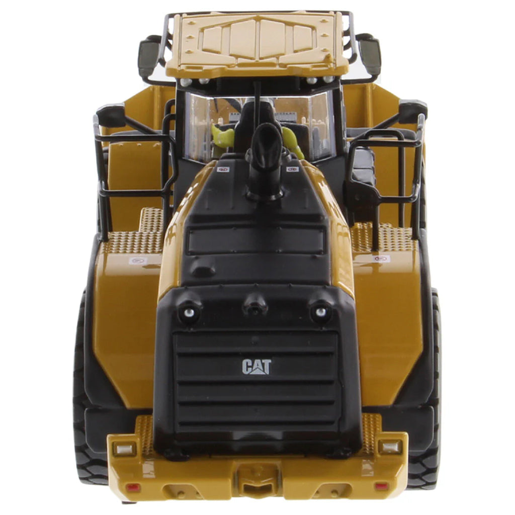 Model of a Yellow Caterpillar 972XE Wheel Loader on a White Background