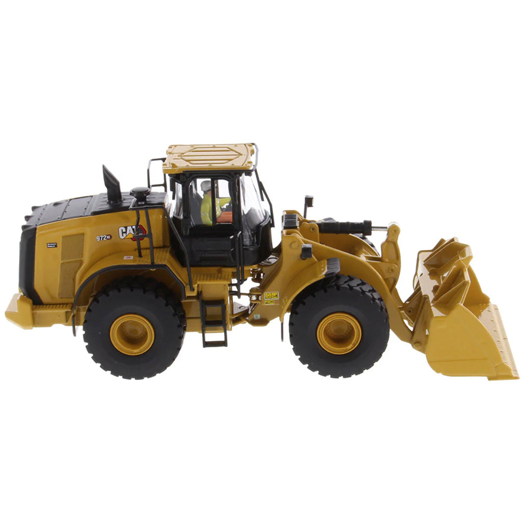 Model of a Yellow Caterpillar 972XE Wheel Loader on a White Background