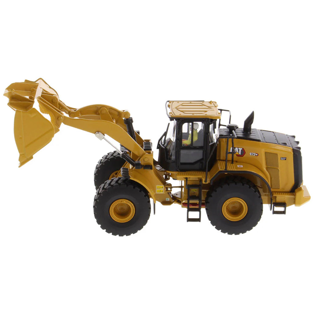Model of a Yellow Caterpillar 972XE Wheel Loader on a White Background