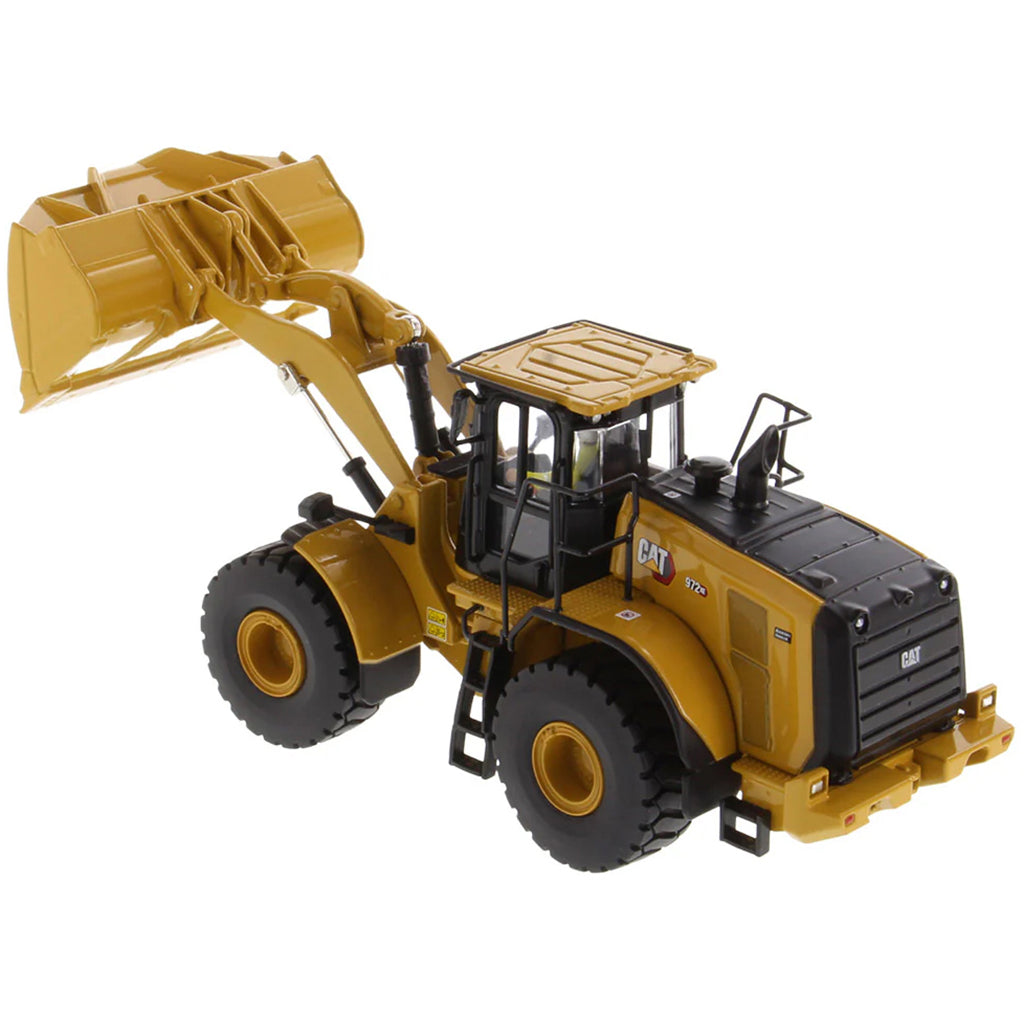 Model of a Yellow Caterpillar 972XE Wheel Loader on a White Background