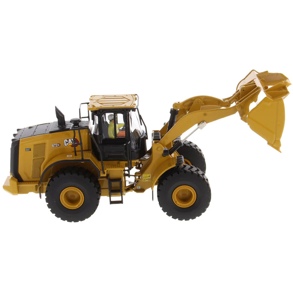 Model of a Yellow Caterpillar 972XE Wheel Loader on a White Background