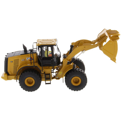 Model of a Yellow Caterpillar 972XE Wheel Loader on a White Background