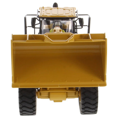 Model of a Yellow Caterpillar 972XE Wheel Loader on a White Background