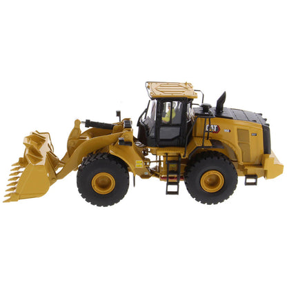 Model of a yellow Caterpillar 966 Wheel Loader construction vehicle on a white background