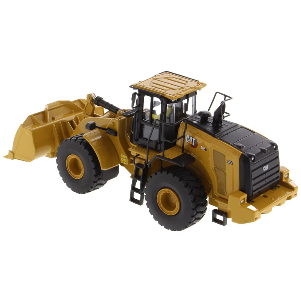 Model of a yellow Caterpillar 966 Wheel Loader construction vehicle on a white background