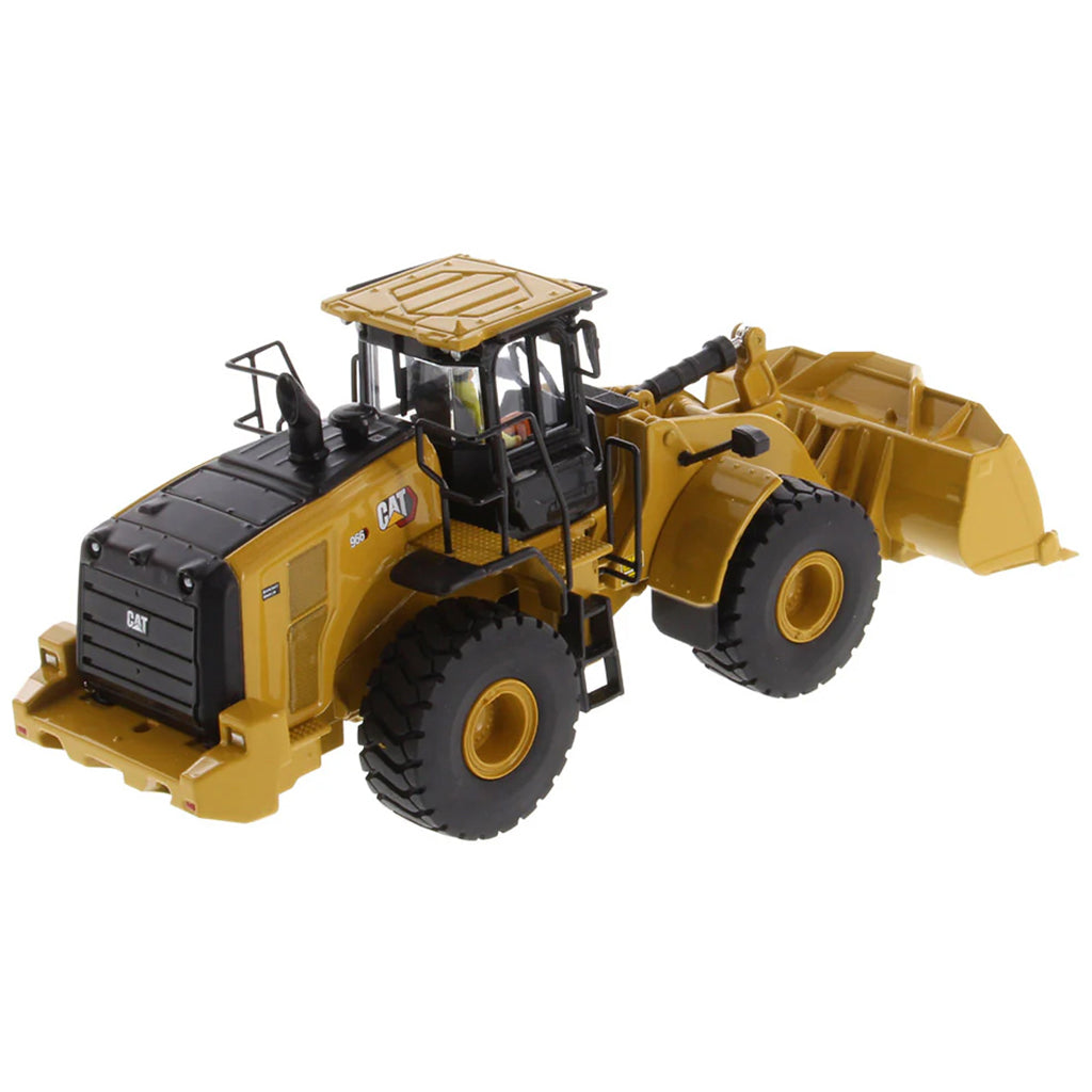 Model of a yellow Caterpillar 966 Wheel Loader construction vehicle on a white background