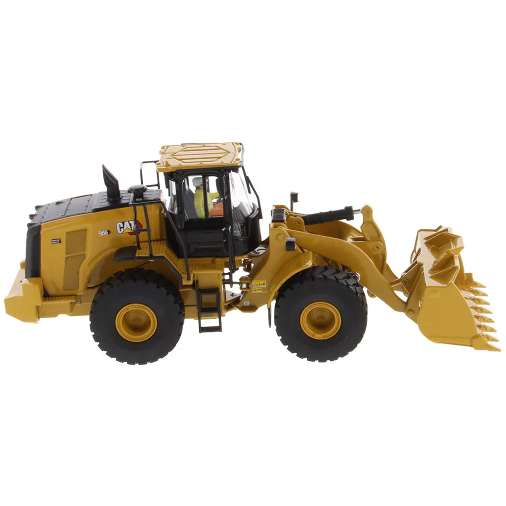 Model of a yellow Caterpillar 966 Wheel Loader construction vehicle on a white background