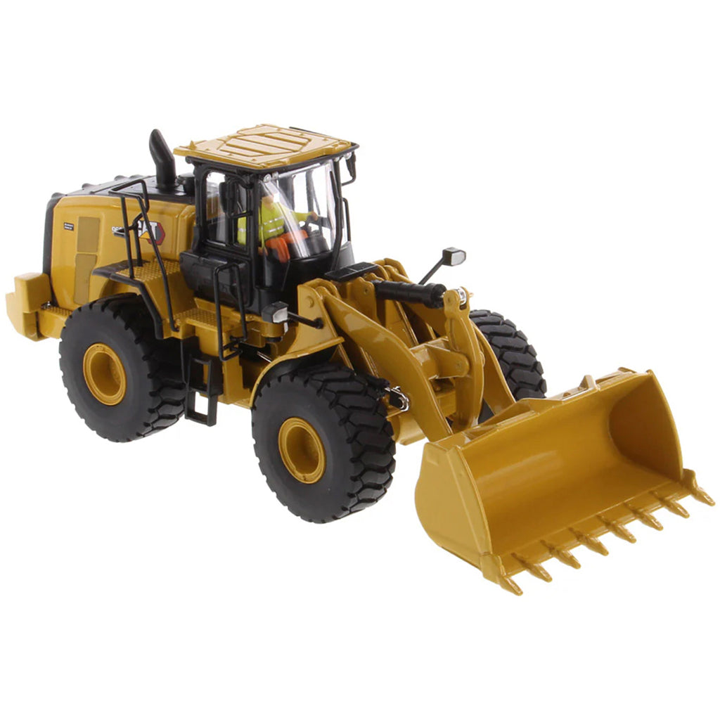 Model of a yellow Caterpillar 966 Wheel Loader construction vehicle on a white background