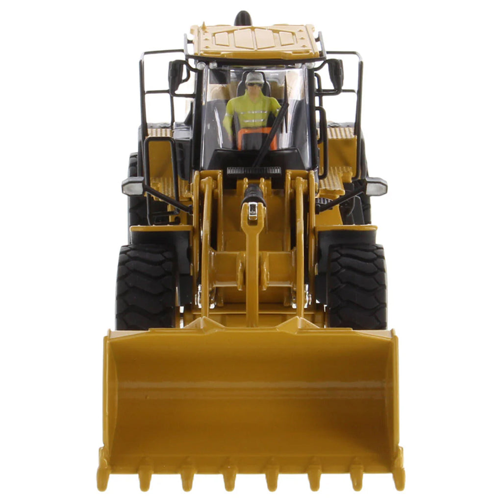 Model of a yellow Caterpillar 966 Wheel Loader construction vehicle on a white background