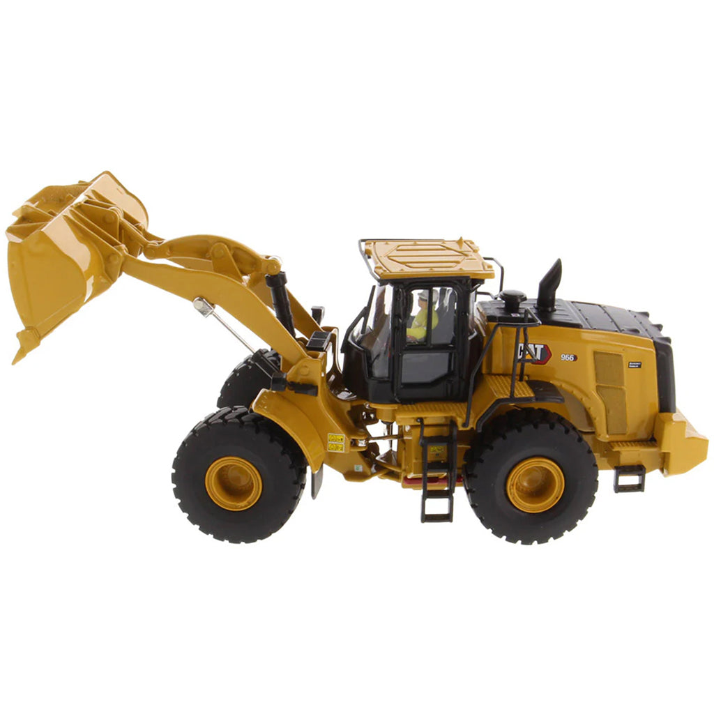 Model of a yellow Caterpillar 966 Wheel Loader construction vehicle on a white background