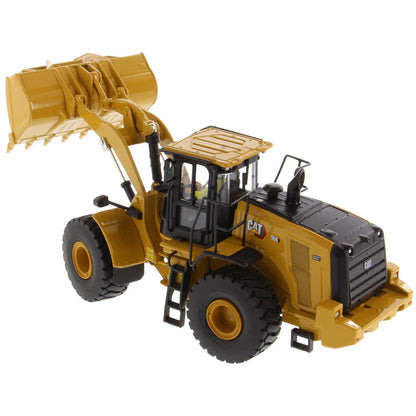 Model of a yellow Caterpillar 966 Wheel Loader construction vehicle on a white background