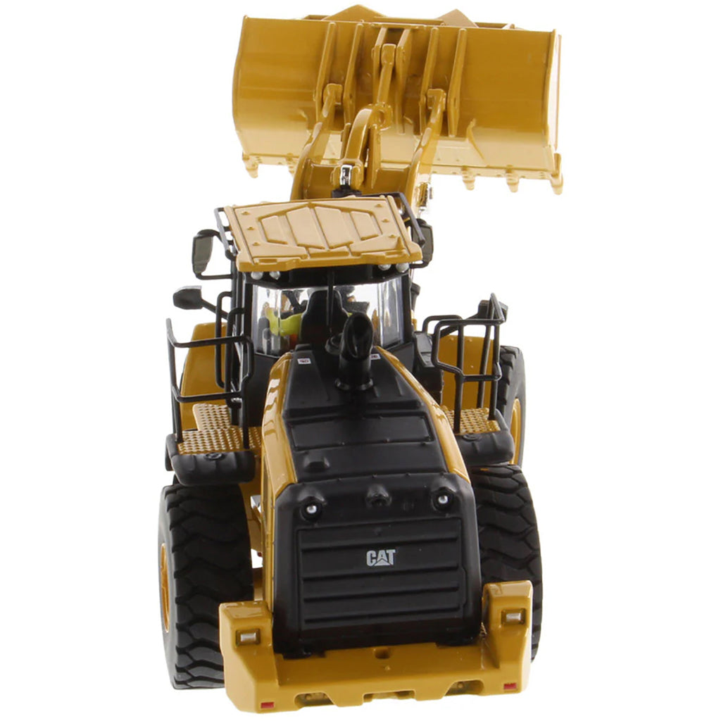 Model of a yellow Caterpillar 966 Wheel Loader construction vehicle on a white background
