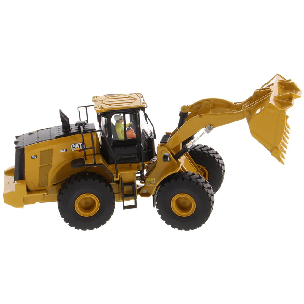 Model of a yellow Caterpillar 966 Wheel Loader construction vehicle on a white background