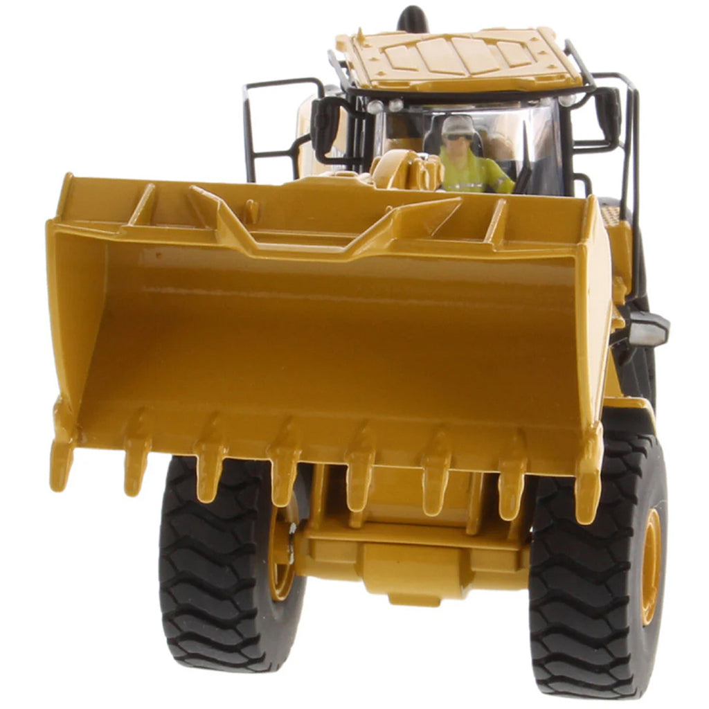 Model of a yellow Caterpillar 966 Wheel Loader construction vehicle on a white background