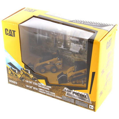 Models of Caterpillar 272D2 Skid-Steer Loader and Cat 297D2 Compact Track Loader in Window Box Packaging on a White Background