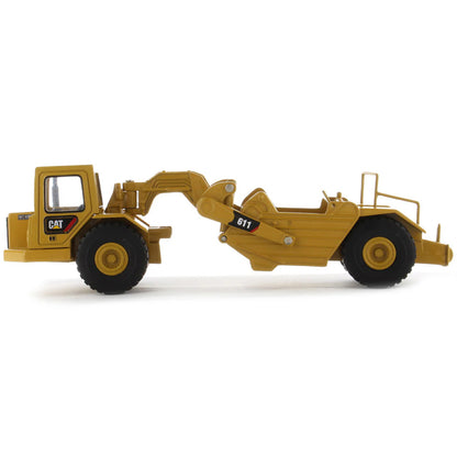 Model of a Caterpillar 611 Wheel Tractor Scraper on a White Background