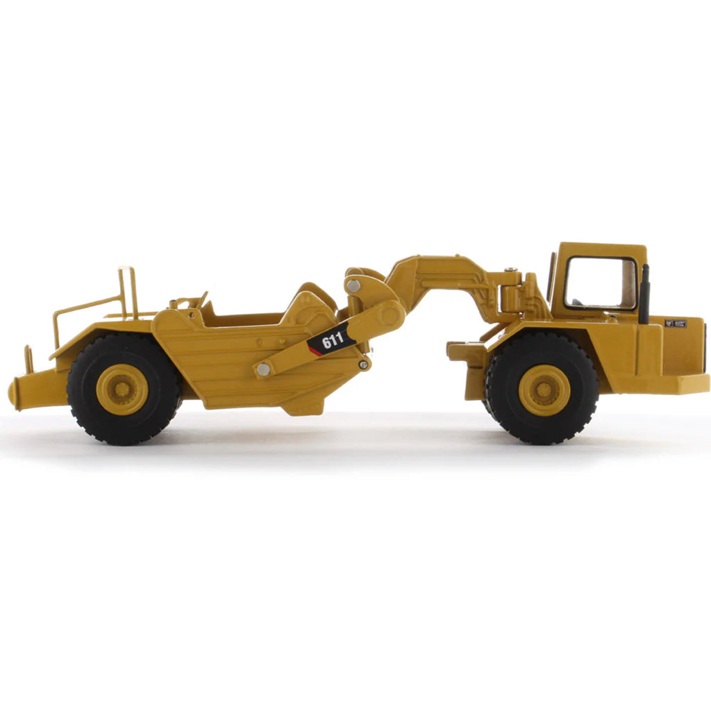 Model of a Caterpillar 611 Wheel Tractor Scraper on a White Background