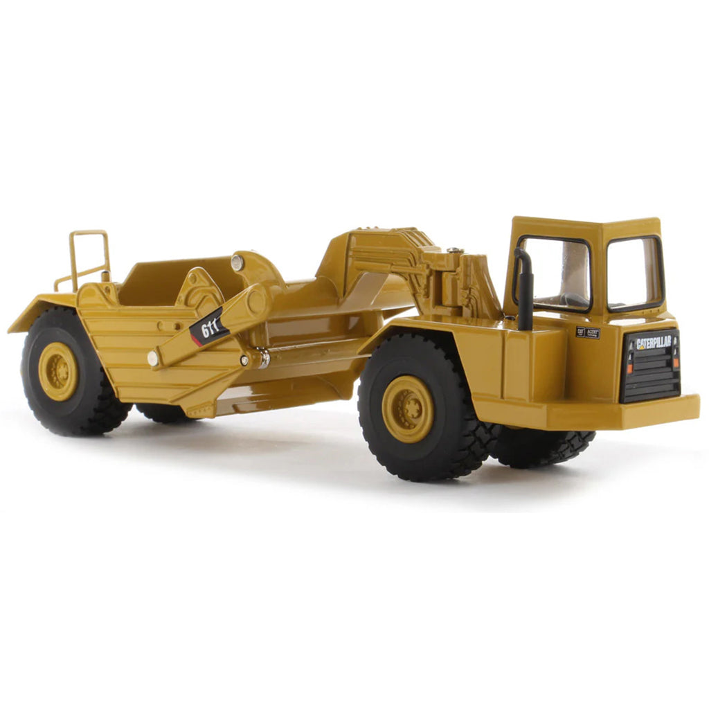 Model of a Caterpillar 611 Wheel Tractor Scraper on a White Background