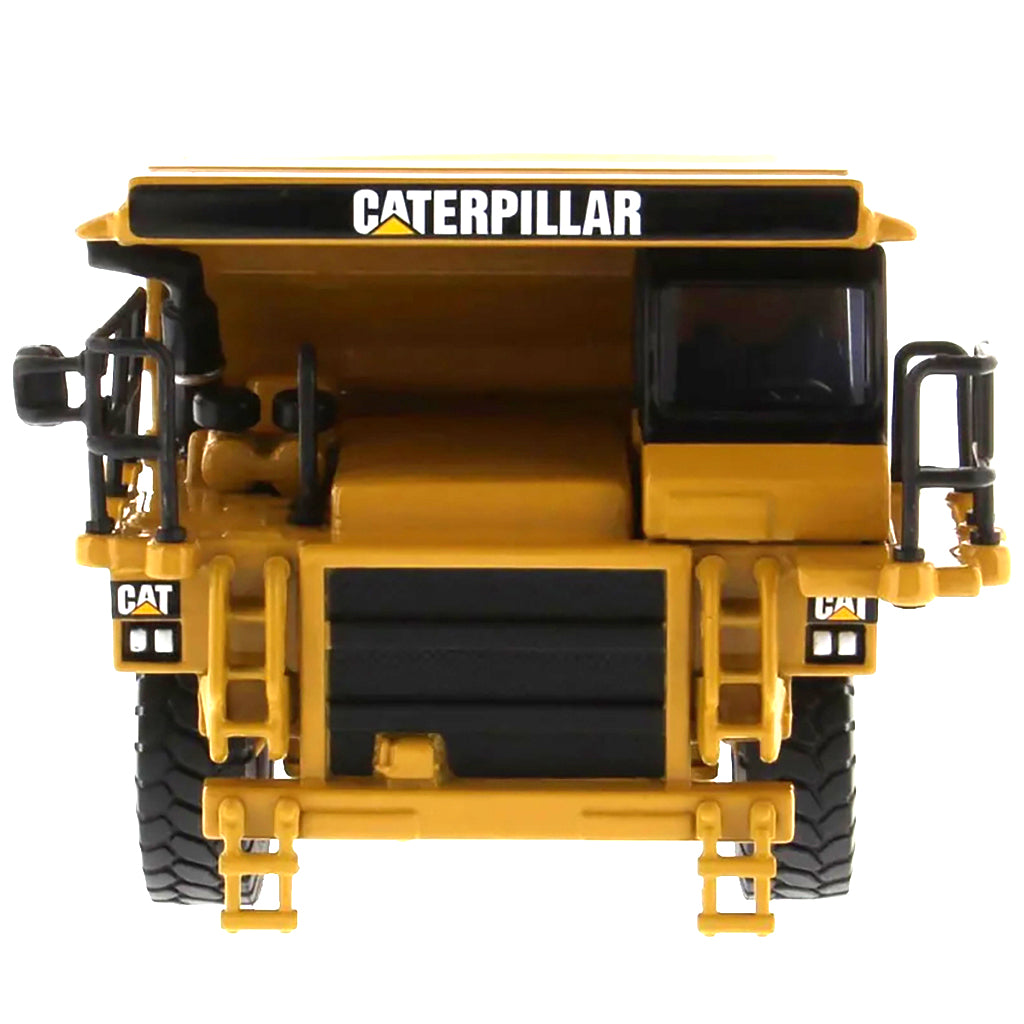 Model of a Caterpillar 775E Off-Highway Dump Truck on a White Background